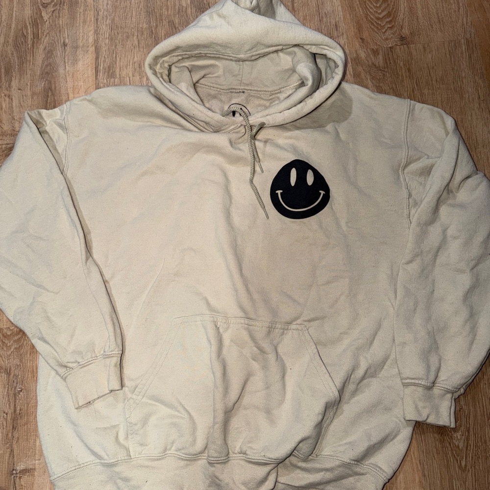 Ascot & Hart Cream Hoodie Sweatshirt with Black Smiley Graphic